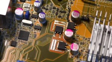 Detail of Electronic Components, Microchip and Capacitors on modern PC Motherboard.