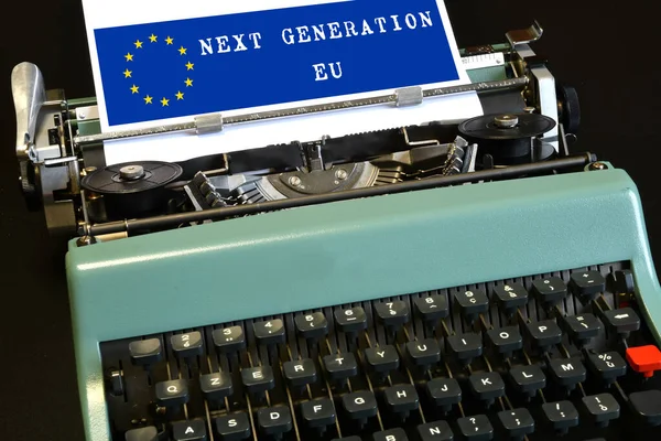 words \'Next Generation EU\' on a blue background and european union logo typed on a vintage typewriter. The National Recovery and Resilience Plan is part of the Next Generation EU programme.