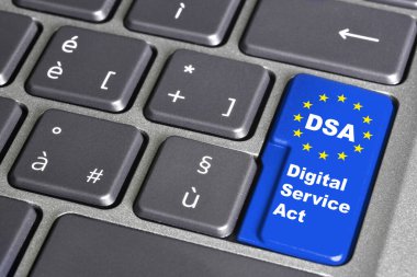 Digital services act (DSA) concept: Enter key on computer keyboard with europe flag, and the text 