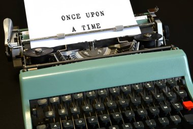 Close-up of a vintage typewriter with text 
