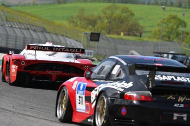 Scarperia, 5 April 2024: Maserati MC12 GT1 year 2005 in action during Mugello Classic 2024 at Mugello Circuit in Italy. clipart