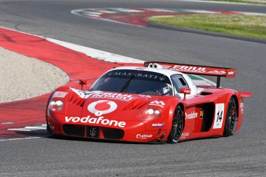 Scarperia, 5 April 2024: Maserati MC12 GT1 year 2005 in action during Mugello Classic 2024 at Mugello Circuit in Italy. clipart