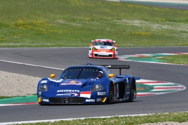 Scarperia, 5 April 2024: Maserati MC12 GT1 year 2005 in action during Mugello Classic 2024 at Mugello Circuit in Italy. clipart