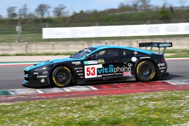 Scarperia, 5 April 2024: Aston Martin DBR9 year 2006 in action during Mugello Classic 2024 at Mugello Circuit in Italy. clipart