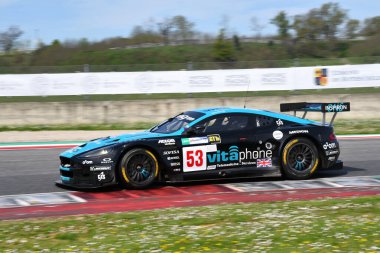 Scarperia, 5 April 2024: Aston Martin DBR9 year 2006 in action during Mugello Classic 2024 at Mugello Circuit in Italy. clipart