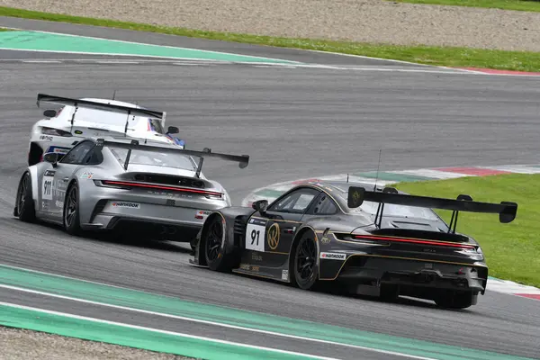 stock image Scarperia, 23 March 2024 Italy: Porsche 911 GT3 R (992) of Team Herberth Motorsport drive by Noble-Bohn-Hart in action during 12h Hankook at Mugello Circuit.