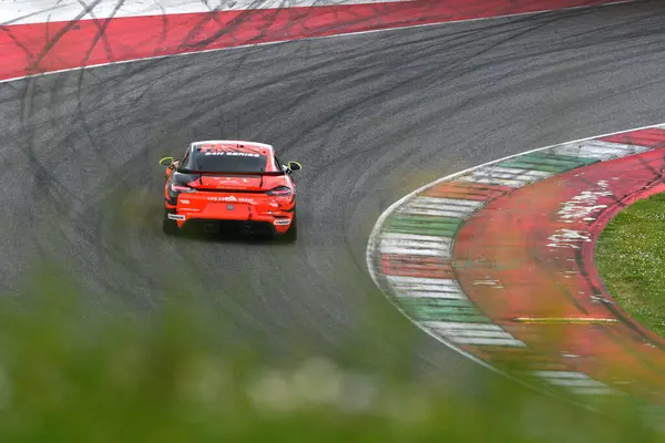 stock image Scarperia, 23 March 2024 Italy: Porsche 718 Cayman GT4 RS of Team Lionspeed GP drive by Garcia-Miller-Kolb-Bohn in action during 12h Hankook at Mugello Circuit.