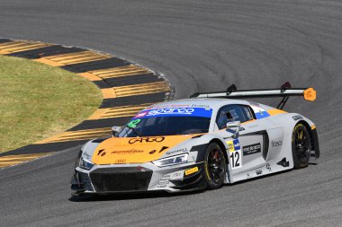 Scarperia, Italy - July 13th 2024: AUDI R8 LMS of team Tresor Audi Sport Italia drive by Mazzola Rocco and Delli Guanti Pietro in action during ACI CSAI Racing Weekend 2024 at Mugello Circuit. clipart