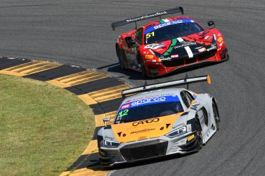 Scarperia, Italy - July 13th 2024: AUDI R8 LMS of team Tresor Audi Sport Italia drive by Mazzola Rocco and Delli Guanti Pietro in action during ACI CSAI Racing Weekend 2024 at Mugello Circuit. clipart