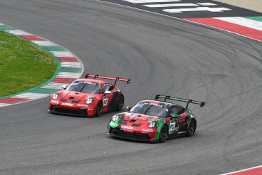 Scarperia, 23 March 2024 Italy: Porsche 911 GT3 Cup (992) of Team Centri Porsche Ticino drive by Presezzi-Busnelli-Jacoma-Fenici in action during 12h Hankook at Mugello Circuit. clipart