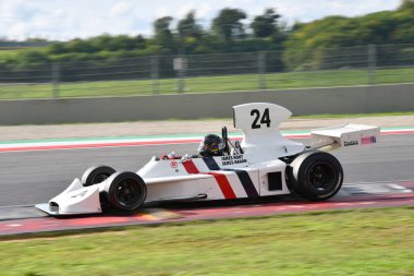 Scarperia, Italy - October 12th 2024: Hesketh 308 of year 1973 ex James Hunt drive by unknown in action during practice session at Mugello Circuit. clipart