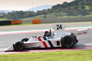 Scarperia, Italy - October 12th 2024: Hesketh 308 of year 1973 ex James Hunt drive by unknown in action during practice session at Mugello Circuit. clipart