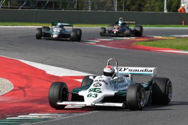 Scarperia, Italy - October 12th 2024: Williams FW07C of year 1981 ex Alan Jones drive by unknown in action during practice session at Mugello Circuit. clipart