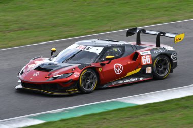 Scarperia, Italy - September 29th 2024: Ferrari 296 LMGT3 of team JMW MOTORSPORT drive by NOBLE-HART-TUCK in action during 4h of Mugello. clipart