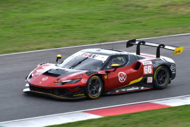 Scarperia, Italy - September 29th 2024: Ferrari 296 LMGT3 of team JMW MOTORSPORT drive by NOBLE-HART-TUCK in action during 4h of Mugello. clipart