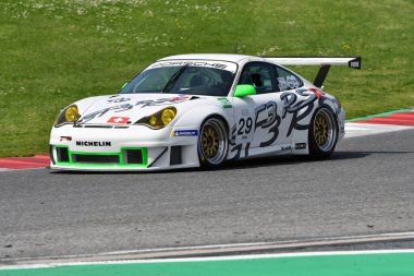 Scarperia, 5 April 2024: Porsche 996 GT3-RSR year 2006 in action during Mugello Classic 2024 at Mugello Circuit in Italy. clipart