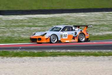 Scarperia, 5 April 2024: Porsche 996 RSR TT year 2006 in action during Mugello Classic 2024 at Mugello Circuit in Italy. clipart