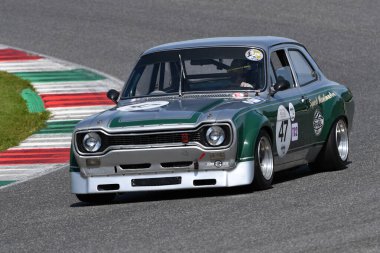 Scarperia, Italy - April 5th 2024: Ford Escort RS 1600 year 1972 in action during Mugello Classic 2024 at Mugello Circuit in Italy. clipart