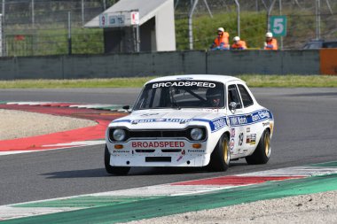 Scarperia, Italy - April 5th 2024: Ford Escort RS 1600 year 1975 in action during Mugello Classic 2024 at Mugello Circuit in Italy. clipart