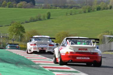 Scarperia, 5 April 2024: Porsche 997 GT3 RSR year 2009 in action during Mugello Classic 2024 at Mugello Circuit in Italy. clipart