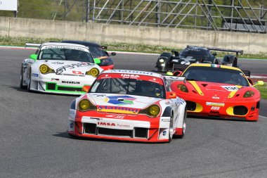 Scarperia, 5 April 2024: Porsche 996 GT3-RSR year 2005 in action during Mugello Classic 2024 at Mugello Circuit in Italy. clipart