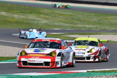 Scarperia, 5 April 2024: Porsche 996 GT3-RSR year 2005 in action during Mugello Classic 2024 at Mugello Circuit in Italy. clipart