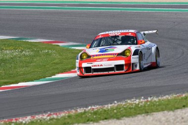 Scarperia, 5 April 2024: Porsche 996 GT3-RSR year 2005 in action during Mugello Classic 2024 at Mugello Circuit in Italy. clipart