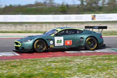 Scarperia, 5 April 2024: Aston Martin DBR9 year 2006 in action during Mugello Classic 2024 at Mugello Circuit in Italy. clipart