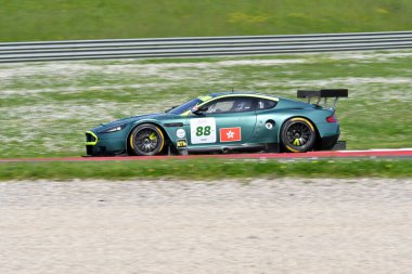 Scarperia, 5 April 2024: Aston Martin DBR9 year 2006 in action during Mugello Classic 2024 at Mugello Circuit in Italy. clipart