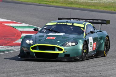 Scarperia, 5 April 2024: Aston Martin DBR9 year 2006 in action during Mugello Classic 2024 at Mugello Circuit in Italy. clipart