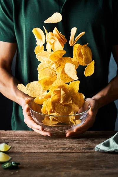 Close Person Holding Bowl Tortilla Chips Throwing Them Air Exciting — Stock Photo, Image