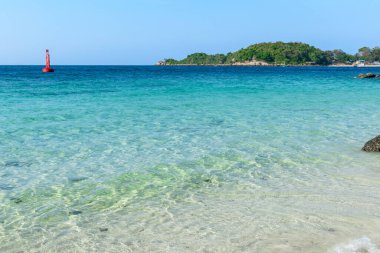 Landscape of clear blue sea and tropical beach on clear blue sky and island background morning day at Koh Larn island. Panorama ocean. Pattaya, Thailand. Wave, Fairway Buoy, Seascape, Vacation. clipart