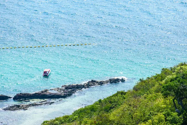 stock image Landscape of blue sea with speedboat and mountain morning day at Koh Larn island. View point on mountain to see view of beautiful nature sea and wave. Panorama ocean. Pattaya, Thailand. Vacation.