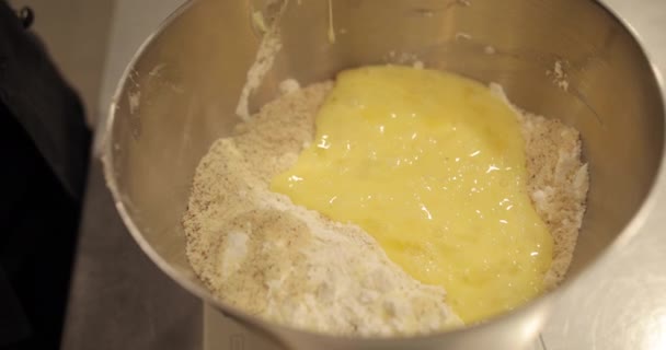 Professional Pastry Chef Woman Mixes Eggs Adds Them Large Bowl — Stock Video