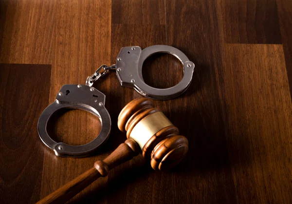 Judge Gavel Handcuffs Wooden Table Law Royalty Free Stock Photos