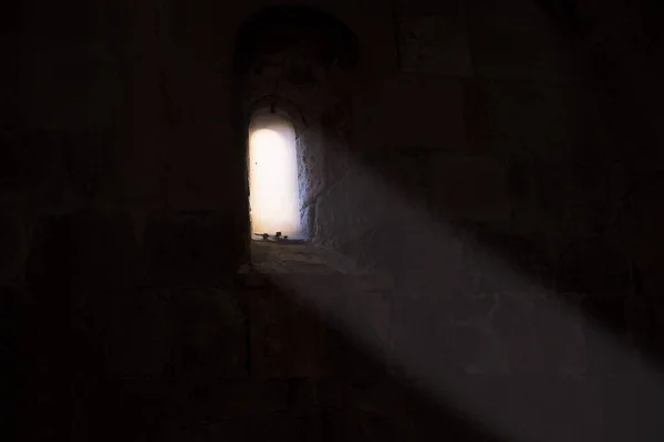 light falling through a window in an old church