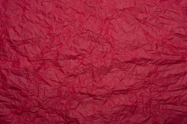 Red paper backround. Red crumpled paper texture.