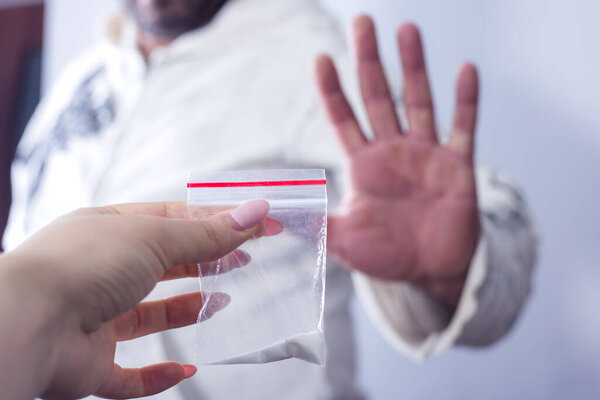 Stop drug addiction concept. Human hands stop drugs