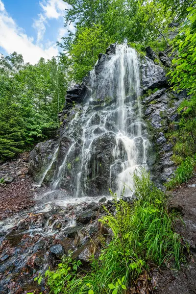 Stock image A view of the Radau waterfall in the Harz Mountains in Germany in glorious summer weather.