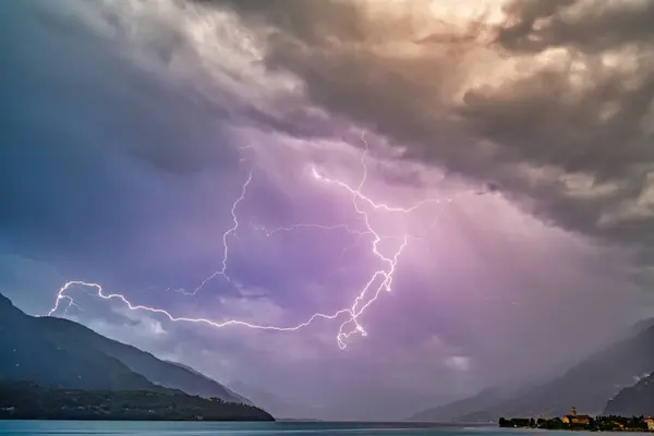 Stock image A strong thunderstorm with lots of lightning over Lake Como