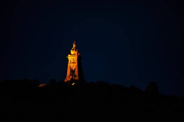 A view of the Kyffhaeuser Monument at night clipart