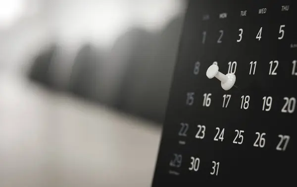 black calendar on the background of the computer monitor with the number 1 1. the calendar is a date in the office.