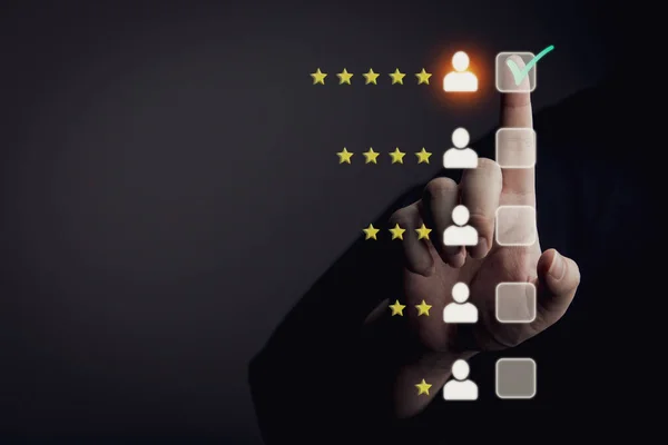 businessman pressing customer rating icon on screen. business customer rating concept.