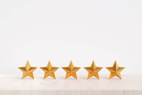 rating stars on a wooden desk.