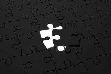 Son parça siyah yapboz yerleştiriliyor.