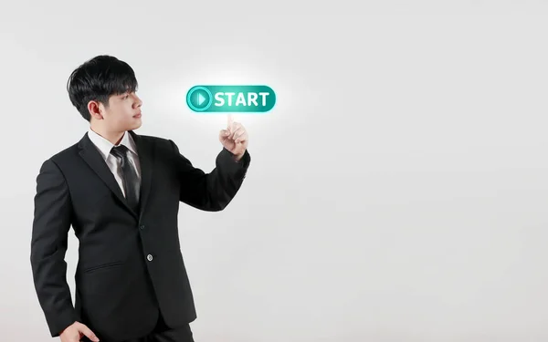 Businessmen touch on virtual screen start button. concept business of new start, business planning, strategies and challenges or career paths, opportunities, and changes.