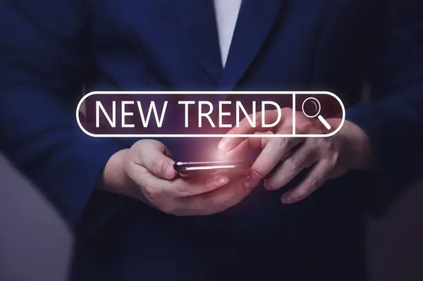 New Trends concept. Men use a smartphone to search online. trends of change, media assets, hot topics, and relevant new trends in business. and online media creation content