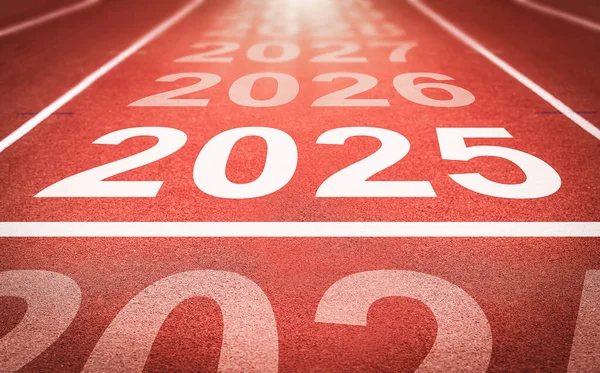 Start of new year. Changes of year 2025, 2026, 2027 on Running track. Concept of new ideas starting in new year, planning along with setting objectives to set KPI goals for success in life.