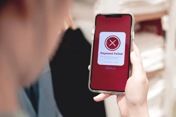 Payment failed, declined. Red online financial transaction notification in application showing error on smartphone. Concept of online banking, encrypting transactions and secure connection.