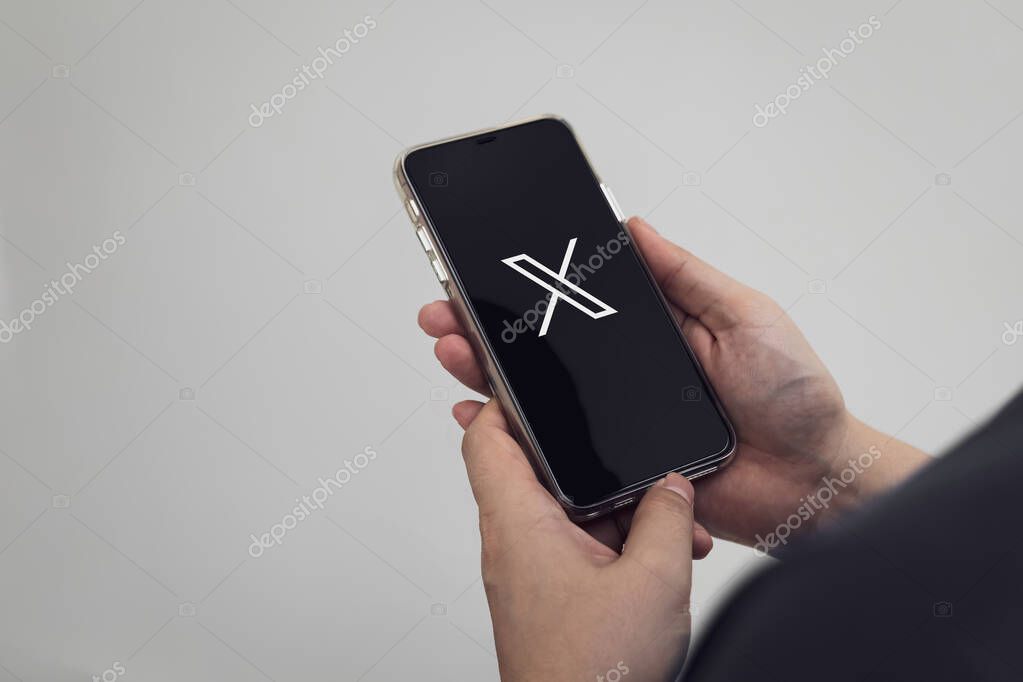 Bangkok, Thailand June 23, 2025. Close-up view of man's opening an App X or formerly Twitter for creating content, and updating news world's most popular social media.